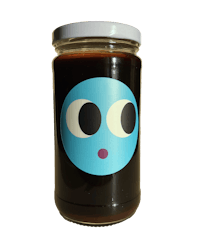 a jar with a blue face on it